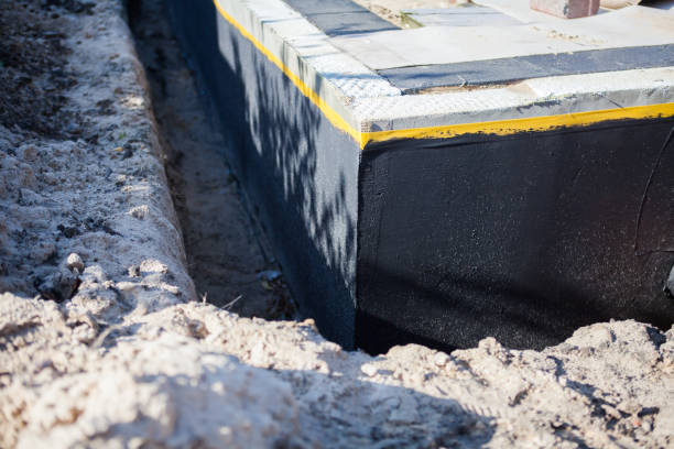 Professional Basement Waterproofing technician working in Amherst, OH